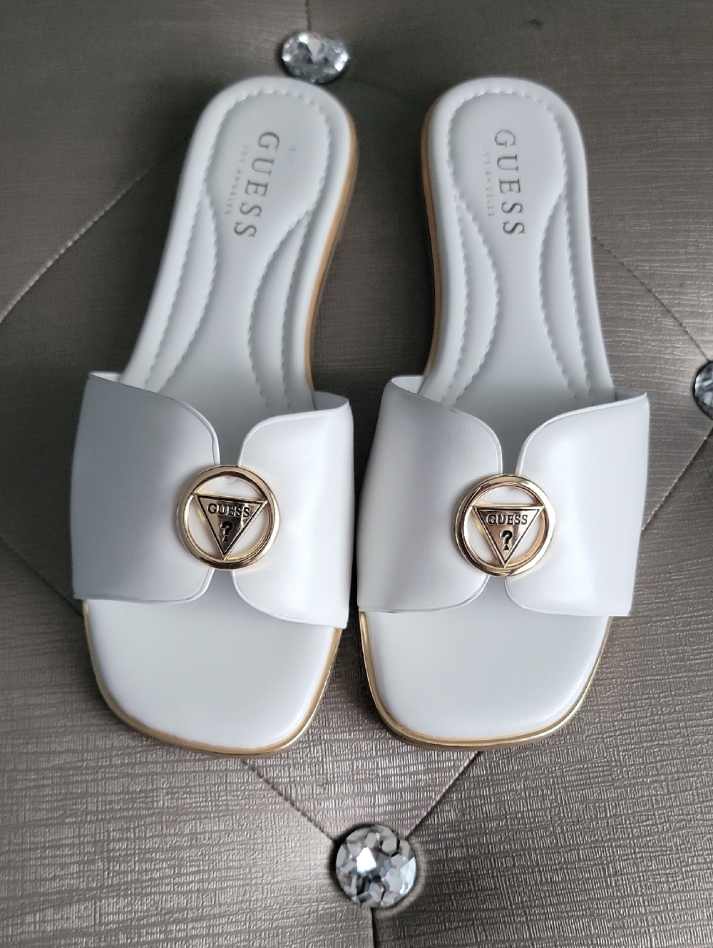 GUESS White Slide Mules with Gold Logo Medallion